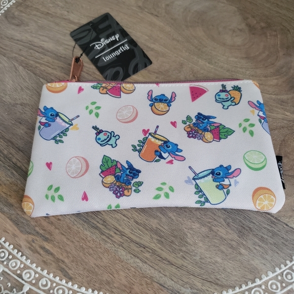 Loungefly Handbags - NWT Loungefly Stitch snacks with Scrump bag